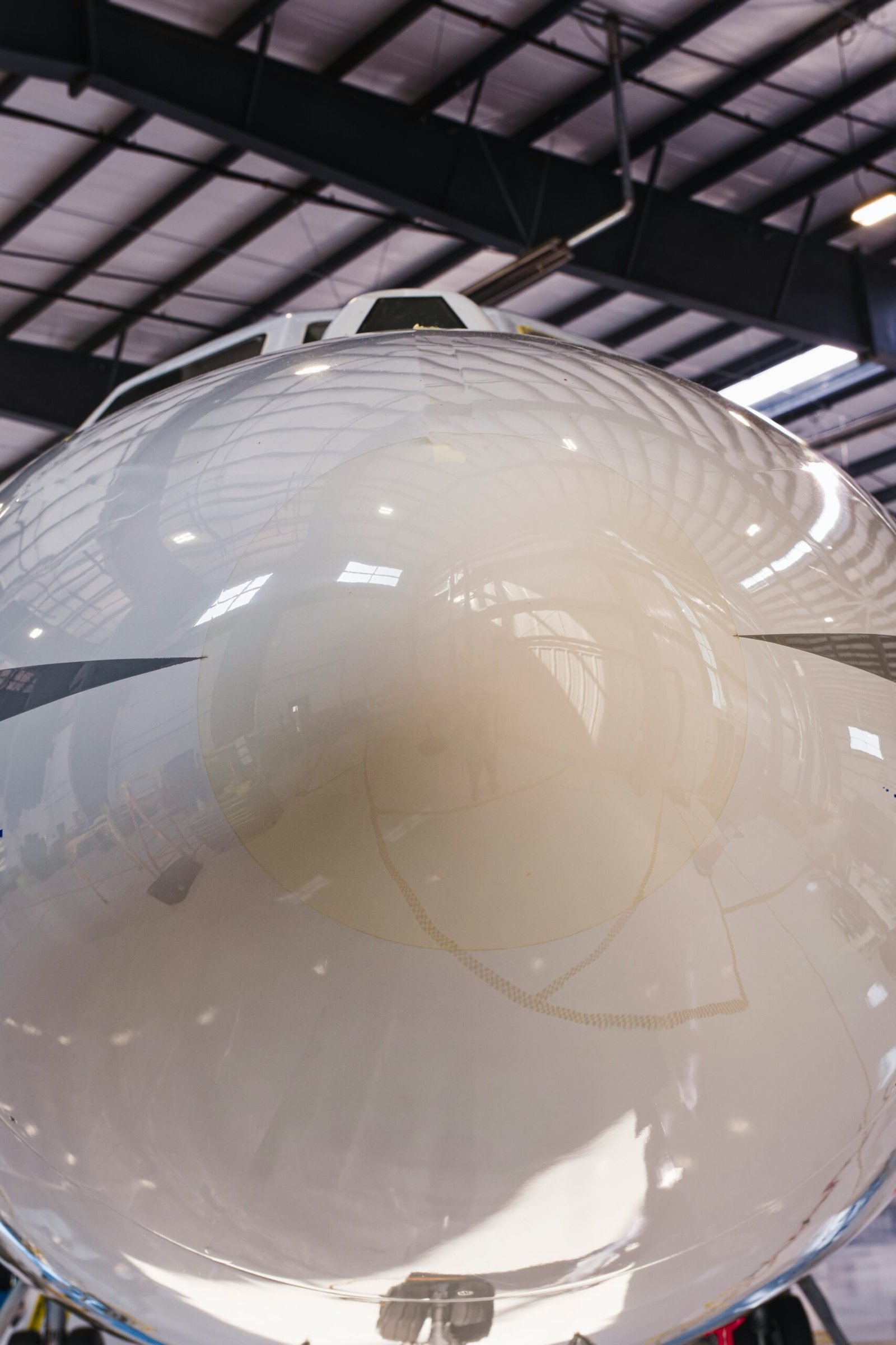 a large jetliner sitting inside of a hangar